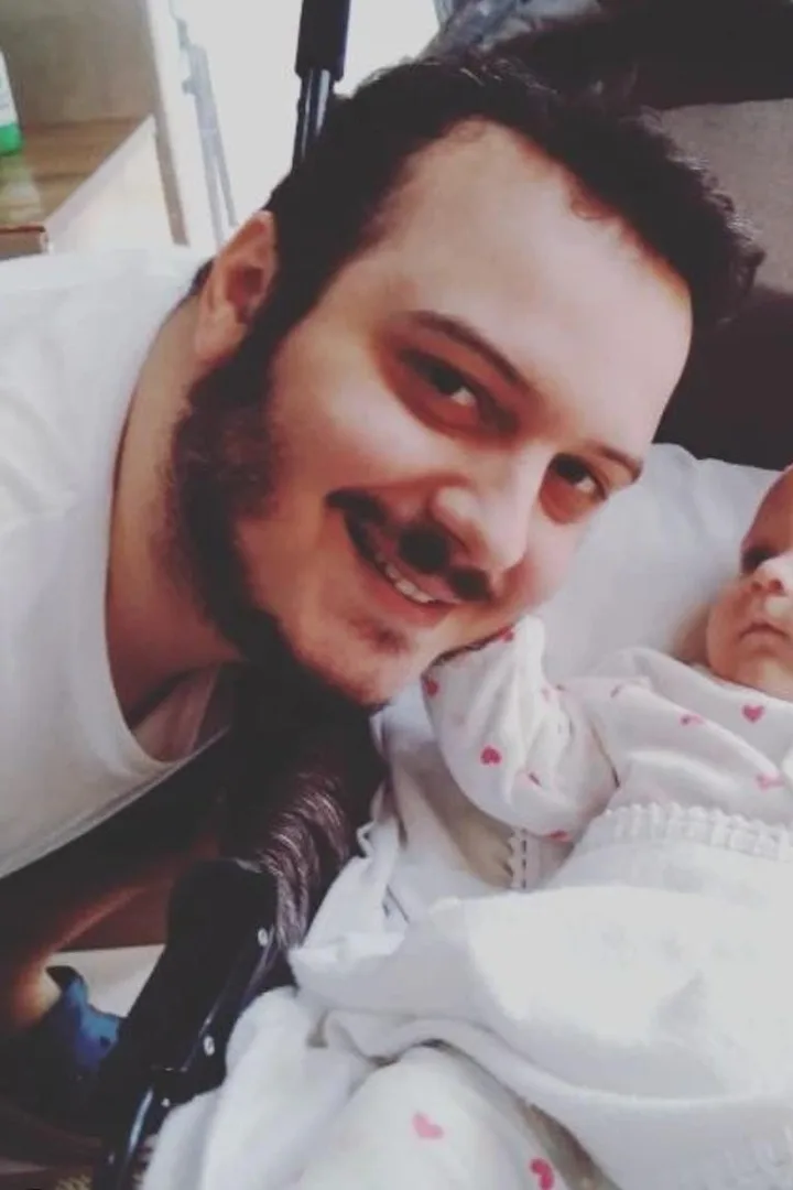 Breno holding his daughter